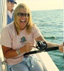 Paula from Narragansett, RI with her first keeper bass.